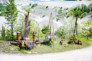 Big mine pit with mining Excavator machinery