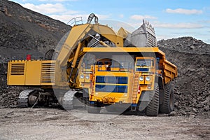 Big mining truck and excavator