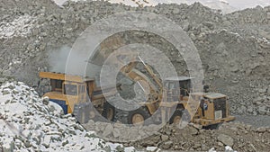 Big mining truck and excavator. Excavation, danger.