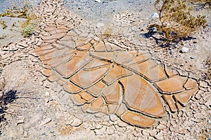 Big mud cud cracks and dried mud tiles in the death valley