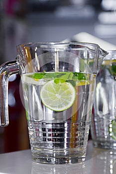 Big mug of fresh water with lemon