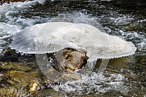 Big natural form ice on the frozen river on the moving river at Thangu and Chopta valley in winter in Lachen. North Sikkim, India