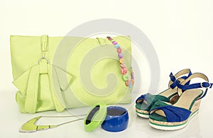 Big neon green bag with matching accessories and cute sandals.