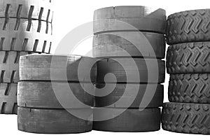 Big new tires for trucks. Black tires are in a row. Isolated background