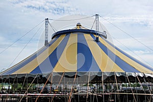 Big noname circus tent under a cloudy sky