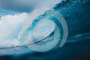 Big ocean blue wave. Breaking barrel wave