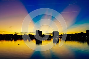 Big OK sign formed by water reflection at sunset of a lake