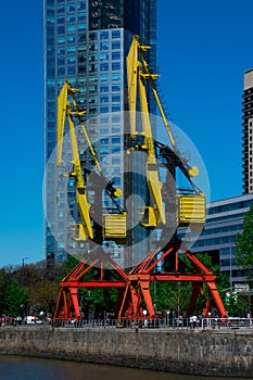 Big old cranes in Puerto Madero neighborhood waterfront