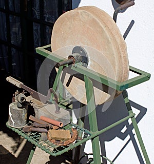 Big old grinding wheel on iron framework