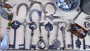 Big old keys and horseshoes on the counter of an antique shop