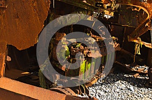 Rusted engine of a wrecked pusher boat photo