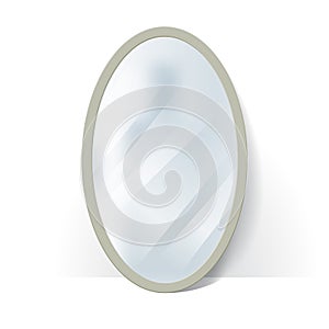Big oval mirror with blurry reflection.