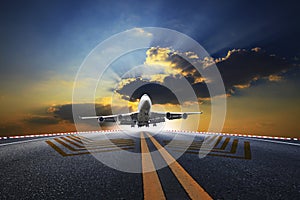 Big passenger plane flying over airport runway