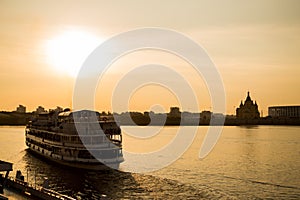 Big passenger ship on river near town