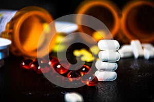Big Pharma Stack of White Pills with Open Pill Bottle background