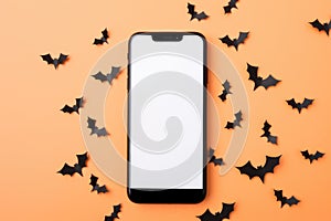 Big phone mock up blank screen on Happy Halloween pumpkins background.