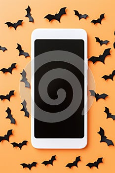 Big phone mock up blank screen on Happy Halloween pumpkins background.