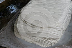 Big piece of white natural rubber