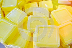 Big pieces of yellow soap with bergamot folded a bunch