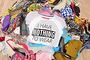 Big pile of clothes thrown on the ground with a t-shirt saying n