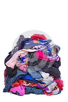 Big pile of old, used clothes isolated on white