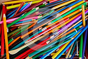 A big pile of school colored wooden pencils