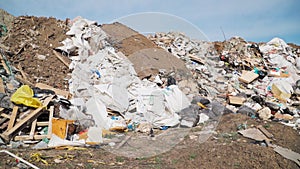 Big piles of garbage. Empty bottles, plastic in the waste dump. ecological disaster. environmental pollution