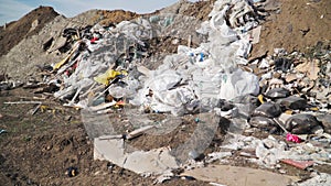 Big piles of garbage. Empty bottles, plastic in the waste dump. Pollution concept. Garbage heap in trash junkyard or landfill.
