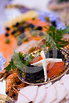 Big plate with red and black caviar