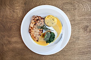 Chicken PART in white plate on the wooden background