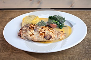 Chicken PART in white plate on the wooden background