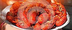 Big plate of tasty boiled crawfish closeup, seafood