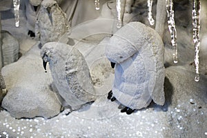 Big plush  penguins in snowy landscape. Winter scenery.