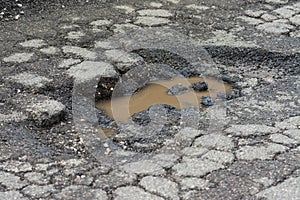 Big pothole caused by freezing and rain in Rome, Italy