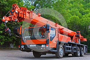 Big Power Mobile Crane on a road and tower crane in construction site