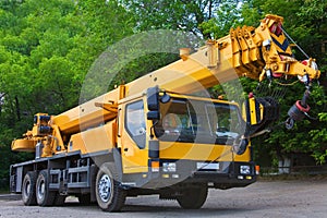 Big Power Mobile Crane on a road and tower crane in construction site