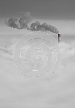 Big power station chimney with smoke above the city smog