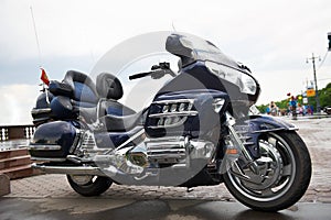 Big powerful luxury travel blue motorcycle