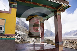 Big prayer wheels in Diskit Monastery or Deskit Gompa for tibetan people and foreign travelers visit and praying and rite rotate photo