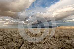 Big puffy clouds over a parched desert