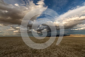 Big puffy clouds over a parched desert