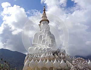 Big Pure White Buddha Statue Against the Cloudy Sky