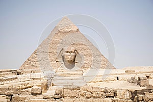 Big pyramid cairo, with sphinx statue in the front. Travel destination background. clear blue sky.