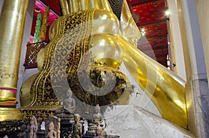 Big reclining buddha statue in ubosot at Wat Phra Non Chakkrasi Worawihan in Singburi city of Sing Buri, Thailand