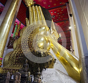 Big reclining buddha statue in ubosot at Wat Phra Non Chakkrasi Worawihan in Singburi city of Sing Buri, Thailand