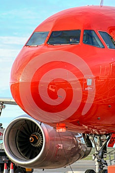 Big red aeroplane, pilots getting ready for take off vertical image photo
