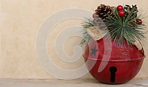 Big red bell  on a tan background with writing space
