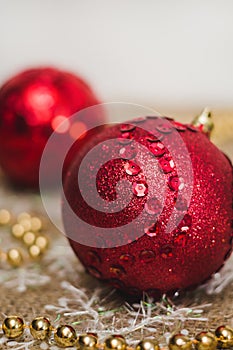 Big red Christmas ball on the background of decorations