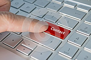 Big red contact us keyboard button. contact inscriptions on the keyboard button.