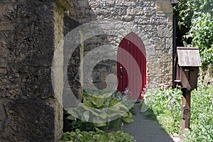 Big red door of an old stone church